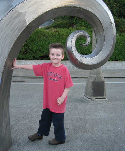 Thing Two plays in Salmon Waves sculpture