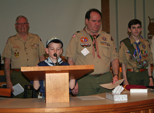 Cousin M leads the closing ceremony